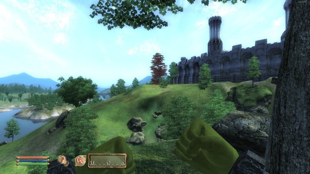 A scenic view from the game Elder Scrolls IV: Oblivion featuring trees, a distant castle, and a river under a blue sky.